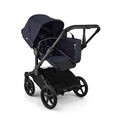 Bugaboo Donkey 6 Cocoa Brown single-to-double all-terrain stroller with toddler and newborn seating, versatile for outdoor use