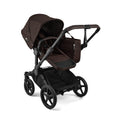 Bugaboo Donkey 6 Cocoa Brown single-to-double all-terrain stroller with toddler seat and bassinet, suitable for newborns and toddlers.