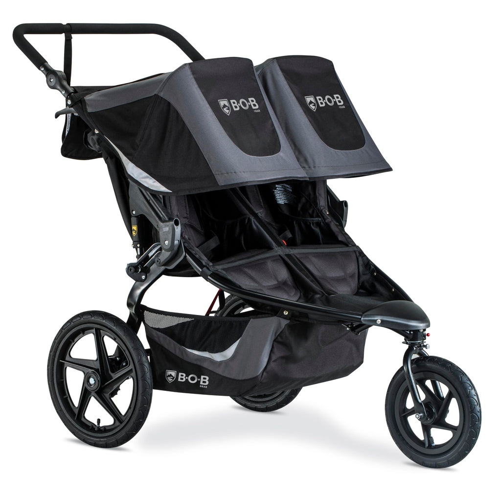 My Store BOB Gear Revolution Flex 3.0 Duallie jogging stroller in graphite black with adjustable handlebars and large wheels for outdoor running.