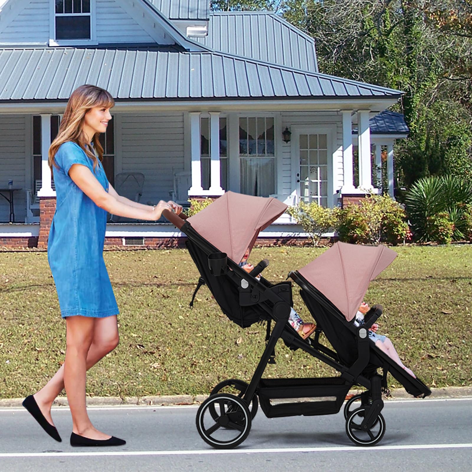 Dark grey tandem double stroller for twins with reversible seats, adjustable canopy, 5-point harness, large storage, and one-hand fold.